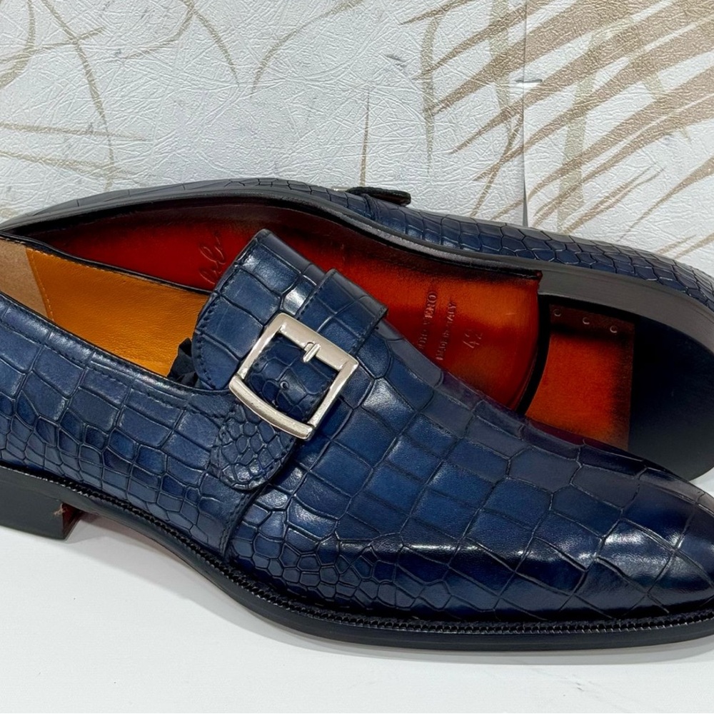Blue leather croc print single monk strap slip on shoe. 
Made in Italy.